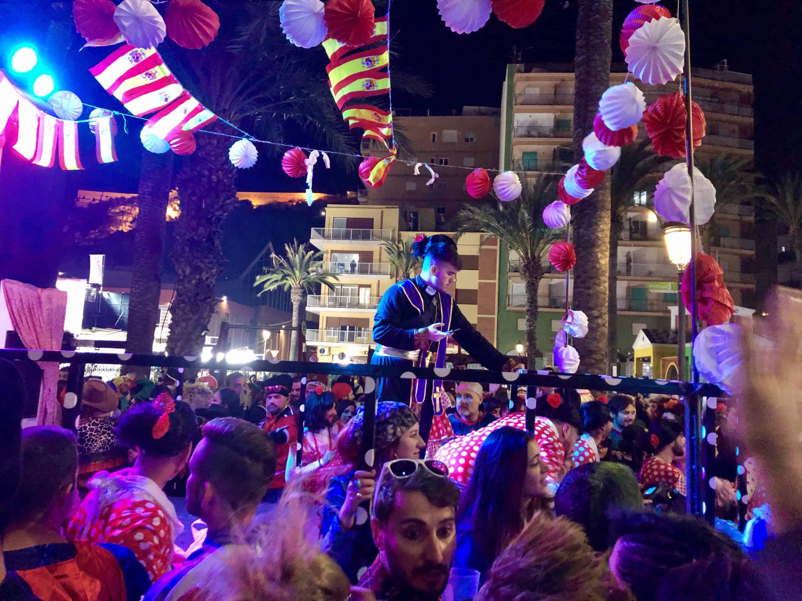 February in Spain during the Carnaval de Aguilas. The streets of this coastal town are filled with people wearing colorful costumes.